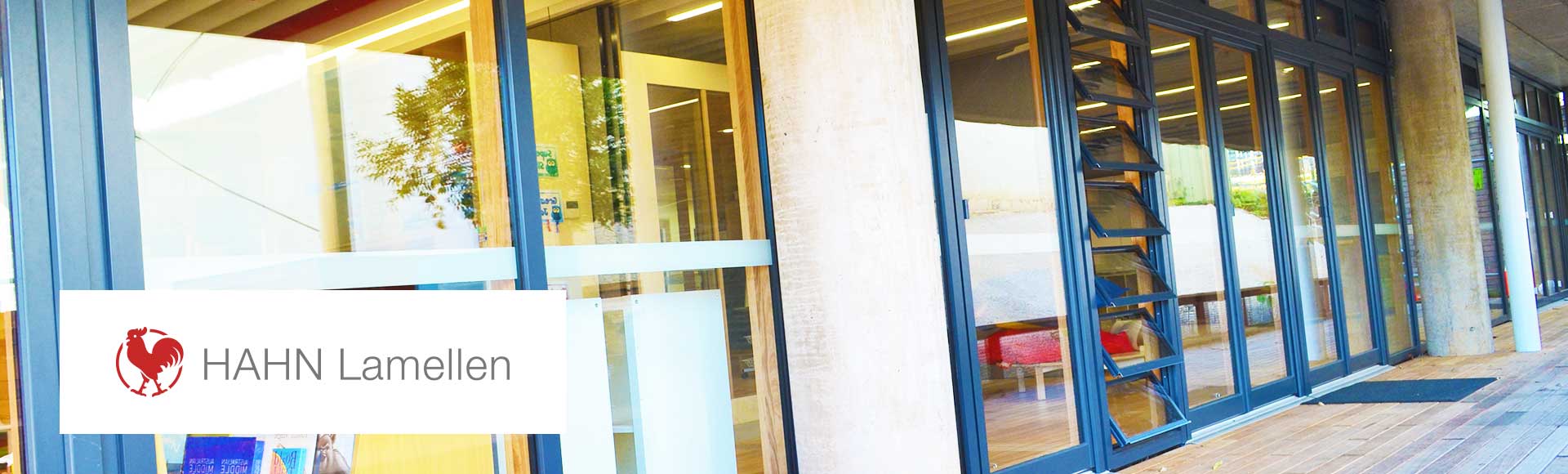 HAHN product banner beautiful facade featuring HAHN louvre windows with deep blue aluminium frame